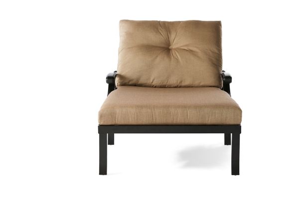 Front view of the Anthem Chaise Lounge and a Half featuring a simple black metal frame with beige fabric on the seat and backrest, highlighted by tufted detailing. The minimalist, modern design is set against a plain white background.