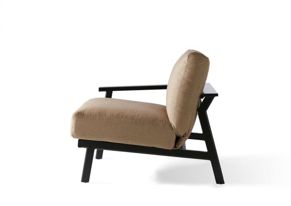 Side view of the Dakoda Cushion LAF Sectional End Unit featuring a tan cushion and black wooden frame. The chair showcases a minimalist design with an angled backrest against a plain white background.