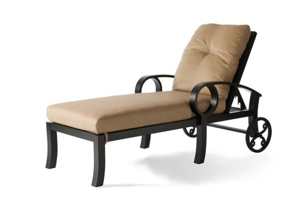 The Eclipse Chaise Lounge features a black metal frame with tan cushions, curved armrests, and two rear wheels for easy mobility.