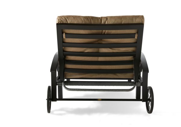 Back view of the Eclipse Oversized Chaise Lounge with a metal frame and brown cushions. It features wheels for portability, horizontal slats, and armrests, showcasing a sleek, modern design.