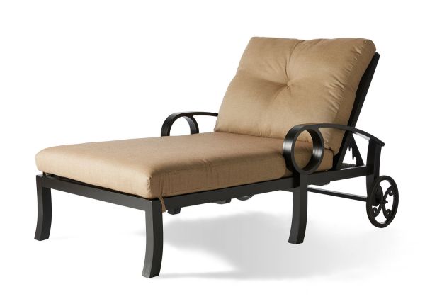 The Eclipse Oversized Chaise Lounge features a beige seat and back cushion, black metal armrests and frame, and rear wheels for easy movement.
