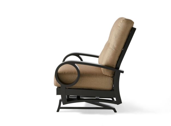 The Eclipse Spring Lounge Chair has a sleek, modern side profile with a black metal frame. It features a tall backrest, round armrests, and is upholstered in light brown fabric. Its design ensures comfort with a sturdy base.