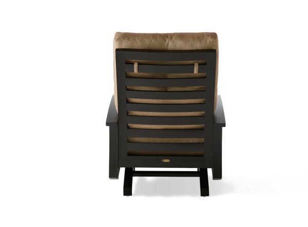 A rear view of the Eclipse Spring Lounge Chair showcases wooden horizontal slats, a beige cushion on the backrest, dark brown armrests, and a sturdy frame against a white background.