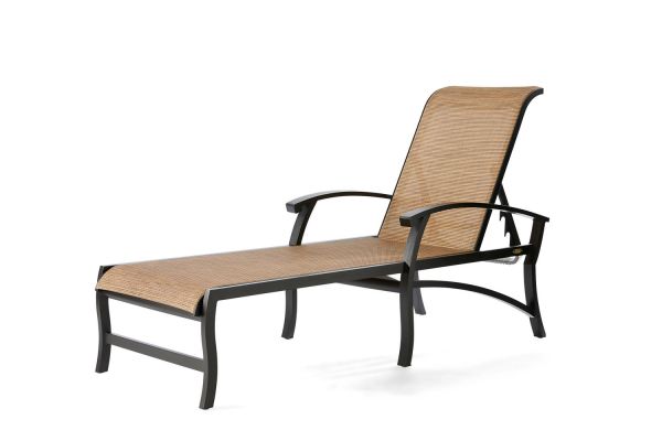 The Georgetown Sling Chaise Lounge is a tan, woven reclining chair with a metal frame and curved armrests, featuring a slightly arched backrest and long, flat seat perfect for outdoor use.