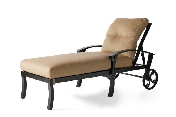 The Georgetown Cushion Chaise Lounge is a beige lounge chair with a metal frame, adjustable backrest, and two wheels for easy movement. Its sleek and minimalistic design makes it perfect for outdoor or patio use.