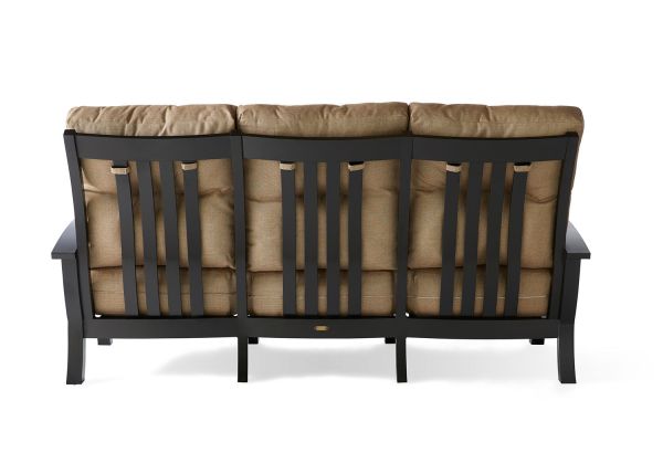The image displays the rear of the Georgetown Cushion Sofa, featuring a black wooden frame with vertical slats and brown cushions, set against a white backdrop.