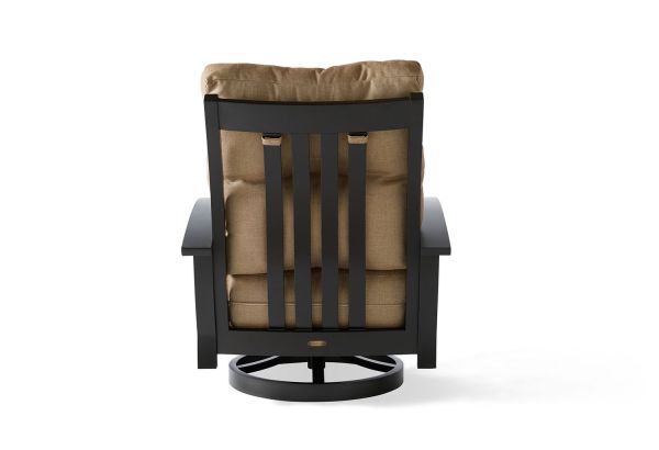 The Georgetown Cushion Spring Swivel Lounge Chair has a dark wooden frame with a brown cushion. From the back, it features vertical slats on the backrest and a circular base for swiveling, showcasing a simple, modern design.