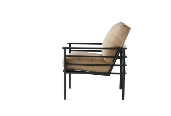 The Sarasota Cushion Dining Armchair is a modern chair with a sleek black metal frame and beige cushions, featuring a geometric design. It has a square profile with straight back and seat, supported by four slender legs.