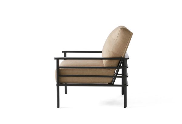 The Sarasota Cushion Lounge Chair features a beige cushioned seat and backrest, supported by a sleek black metal frame with straight legs, showcasing a minimalist design against a plain white background.