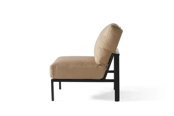 A side view of the Sarasota Cushion Armless Lounge Chair showcases its modern, minimalist look with a beige cushioned seat and backrest set on a sleek angular black metal frame, complete with four straight legs.