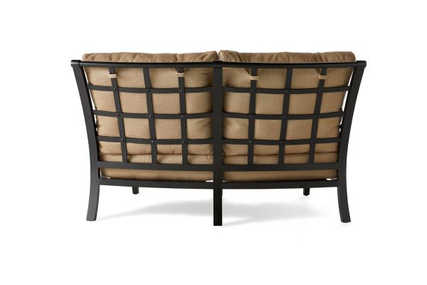 The Turin Cushion Crescent Love Seat features a metal frame with a grid back pattern and brown cushions. Its sturdy metal construction and cozy upholstery make it ideal for indoor or outdoor use.