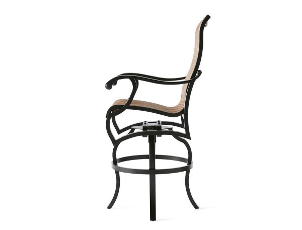 The Volare Sling Bar Stool features a side view of its modern design with a black metal frame, curved backrest, woven light-colored seat and backrest, four slightly flared legs, and a circular footrest.