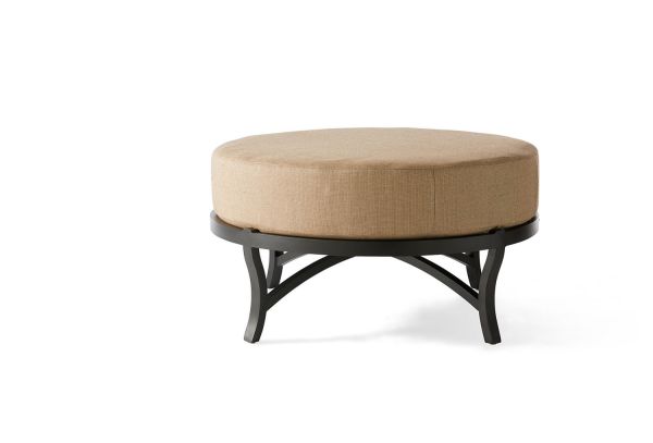 Volare Cushion Circular Ottoman features a round beige cushioned top with a black metal frame and curved legs, displayed on a simple white background.