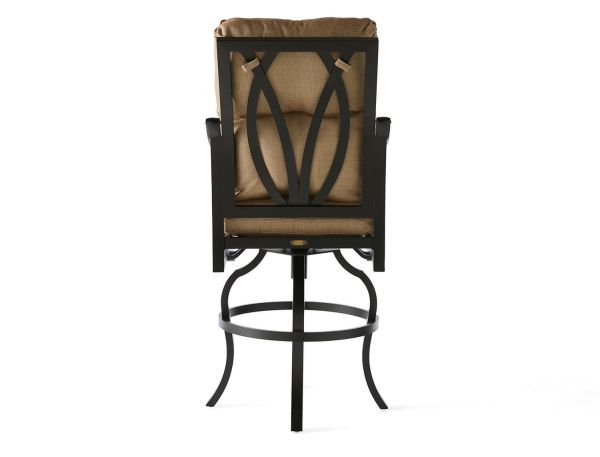 The Volare Cushion Bar Stool boasts a black metal swivel design with an open back and decorative pattern. It features curved legs, armrests, and comes with a brown cushioned seat and backrest, all set against a plain white background.