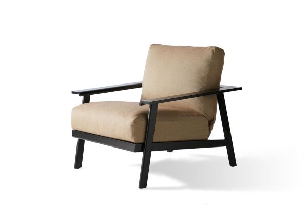 The Dakoda Cushion Lounge Chair features beige cushions and a black metal frame with a minimalistic, angular design for a stylish, contemporary look.