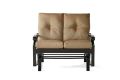 The Anthem Love Seat Glider is a beige cushioned outdoor loveseat with a black metal frame, featuring two tufted seat backs and a slatted base.