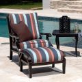 The Turin Cushion Lounge Chair is a brown cushioned armchair with a black metal frame, seen from the front. It boasts thick seat and back cushions for enhanced comfort and an inviting appearance, exuding a modern style.
