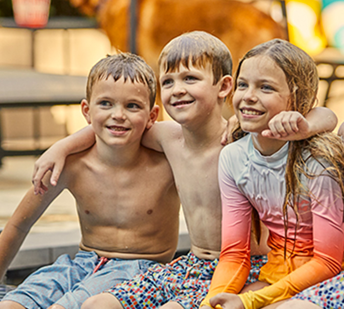 smiling poolside kids